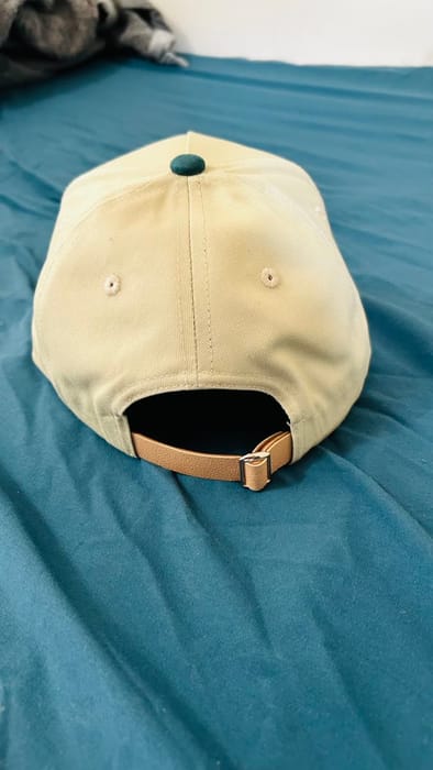 Cream baseball cap with patch by The Fame Lee Clothing
